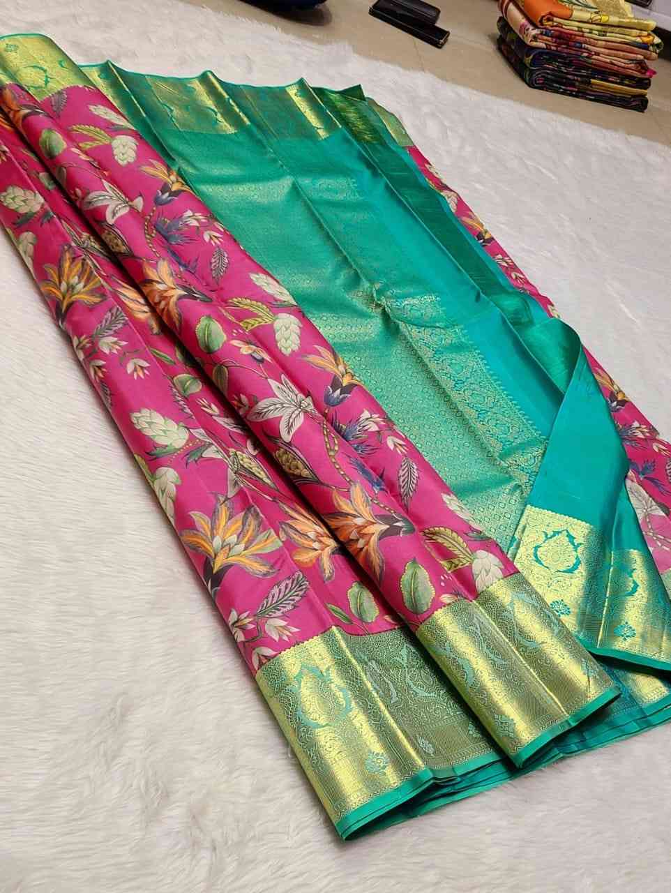 5 <p dir="auto">100% Pure Kanchipuram Handwoven Kalamkari Silk Saree with 1 Gram Gold Pure Zari Weaving and Silk Mark Certificate. Premium lightweight double warp digital print weaving offering smooth silky feel. Elegant 1G small border premium quality silk saree perfect for weddings, festivals and celebrations.</p> - Image 5