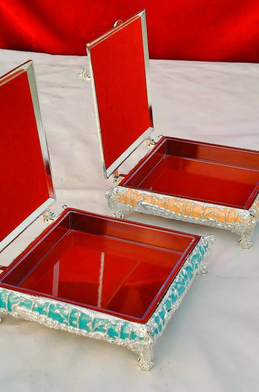 German Silver Enamel Dryfruit Box | Square 5 Inch 1 Pure German silver square dryfruit box with imported enamel finish. Available in 4 colours. Size 5 inch. Cardboard box pack. MOQ 1 piece. German Silver Enamel Dryfruit Box | Square 5 Inch