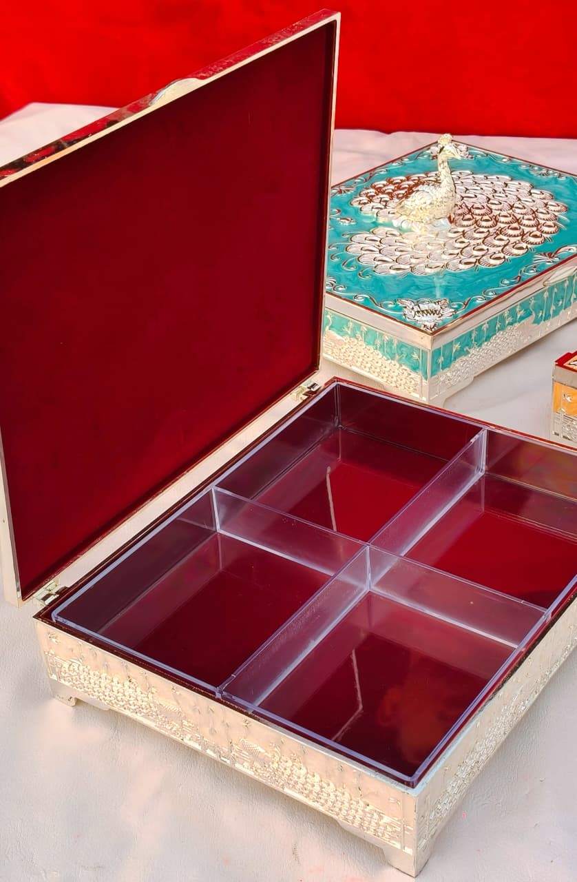 German Silver Peacock Dryfruit Box | 8x7.5 Inch Big Size 3 Big size German silver peacock nakkashi dryfruit box with enamel & acrylic compartment. Size 8"x7.5". Fully washable with never turn black guarantee. 4 enamel colours. MOQ 1 piece. German Silver Peacock Dryfruit Box | 8x7.5 Inch Big Size