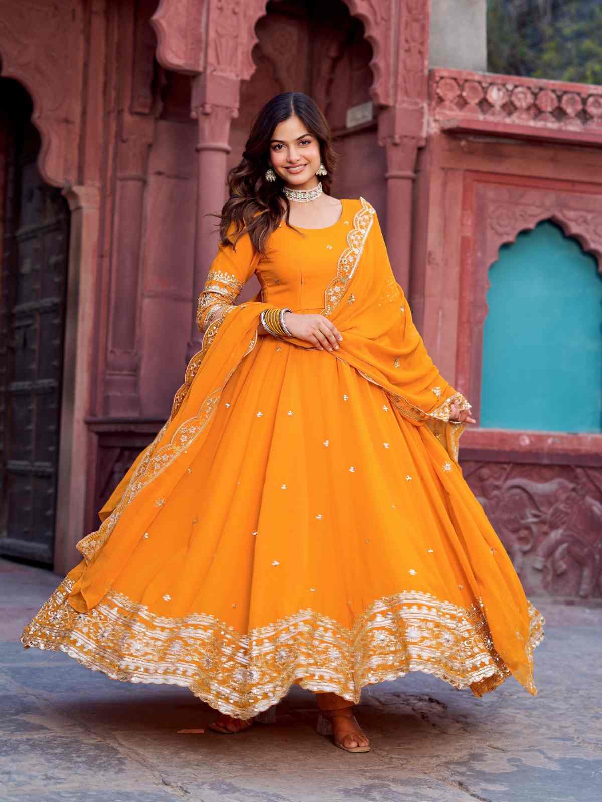 Yellow Faux Georgette Anarkali Gown Set 2026 | Sequence Work 1 Yellow Faux Georgette Anarkali Gown Set with thread & sequence work on front and back, micro inner, full stitch pant with elastic and 2.2 meter dupatta. Available in M, XL, XXL with 3XL margin. Yellow Faux Georgette Anarkali Gown Set