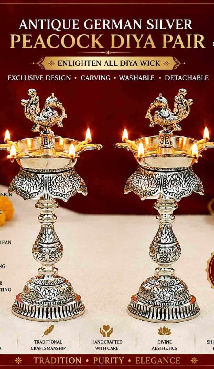 Antique German Silver Peacock Diya Pair | 9.5-10 Inch 1 Antique German silver peacock diya pair with exclusive carving. Washable and detachable. Size 9.5"-10". Perfect for Diwali, puja and festive décor. Antique German Silver Peacock Diya Pair | 9.5-10 Inch