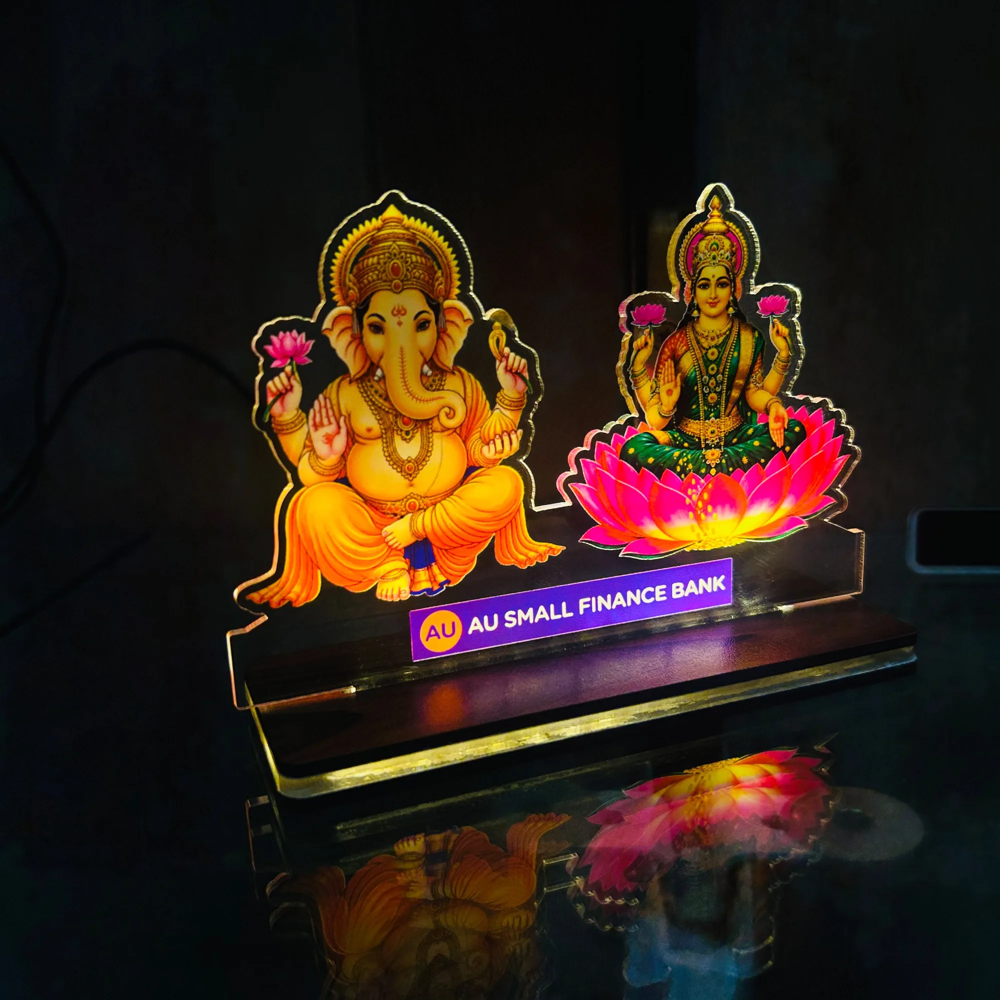 Acrylic Ganesh Lakshmi Lamp | 9x6 Inch Rechargeable 1 Acrylic lamp with Ganesh Ji and Lakshmi Ji, size 9x6 inches. High-quality print. Any name, company name or logo can be added. Rechargeable base. Acrylic Ganesh Lakshmi Lamp