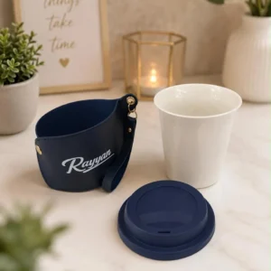 personalized ceramic sipper with leatherette sleeve
